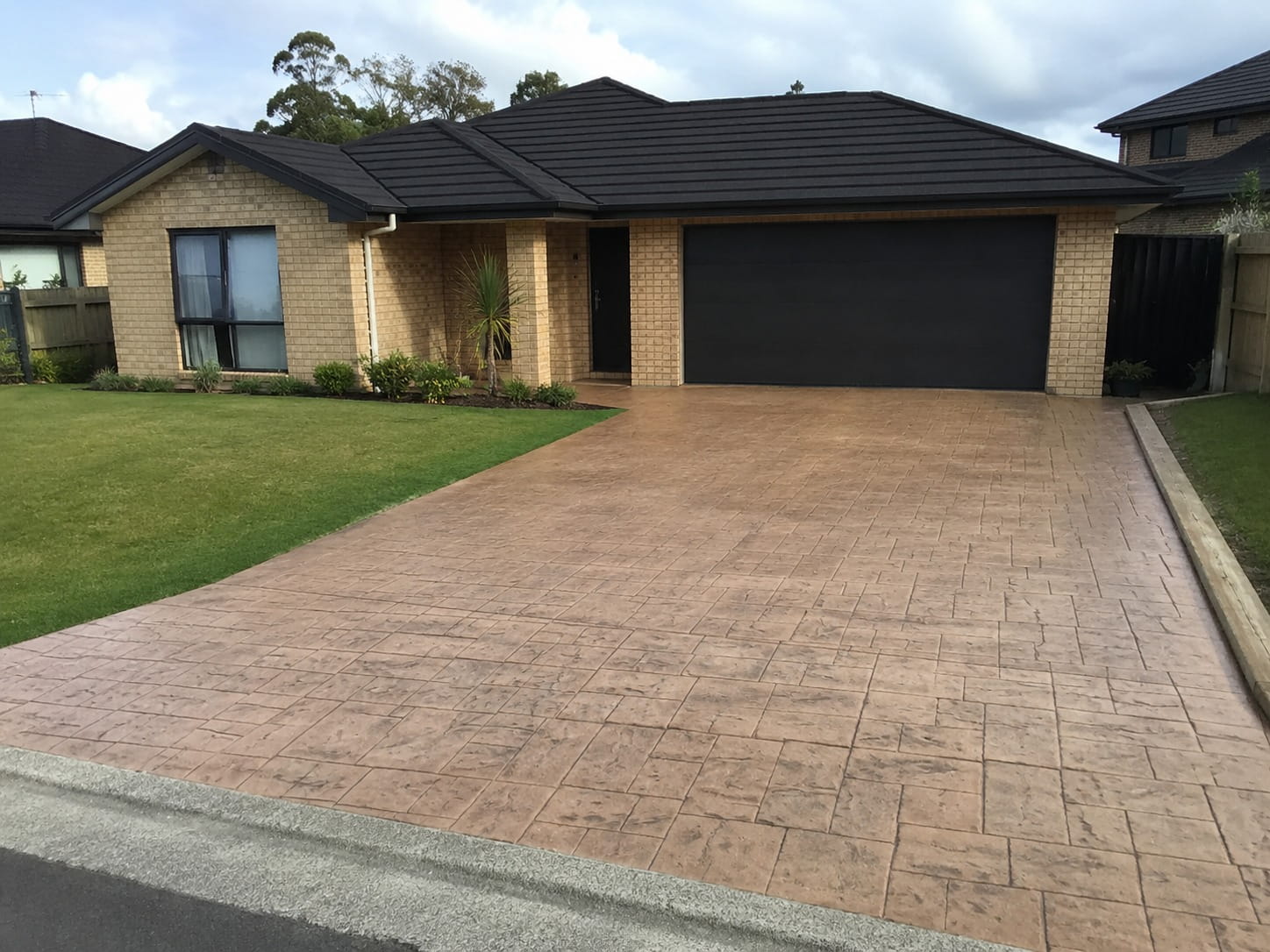 Coloured and stamped concrete driveway Hamilton