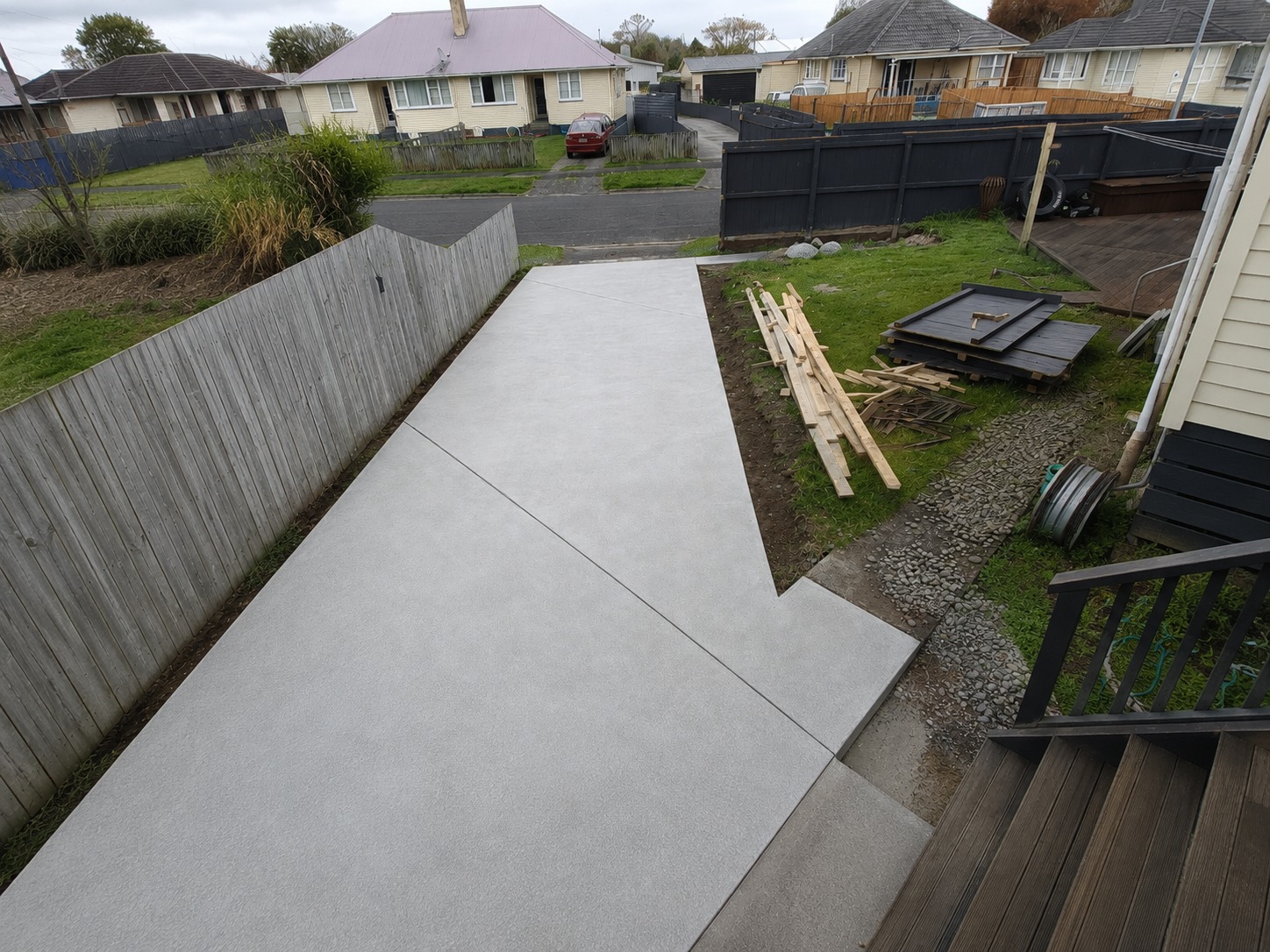 Concrete driveway and parking area viewed from the deck of a Hamilton home